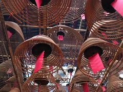 05C Bell shaped joss stick coils of incense hang from the ceiling of the Man Mo Temple Hong Kong